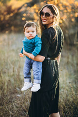 Wall Mural - Mother with little son together in park