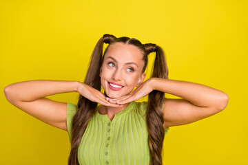 Wall Mural - Portrait of attractive funny cheerful long-haired girl posing beaming white teeth isolated over vivid yellow color background