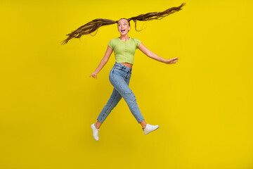 Canvas Print - Full length body size view of attractive girlish childish cheerful girl jumping having fun isolated over bright yellow color background