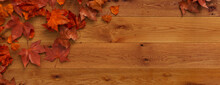 Top Down View Of Natural Wood Tabletop With Leaves.