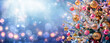 Leinwandbild Motiv Christmas Tree - Ornaments And Snow In Blue Background With Shiny Lights