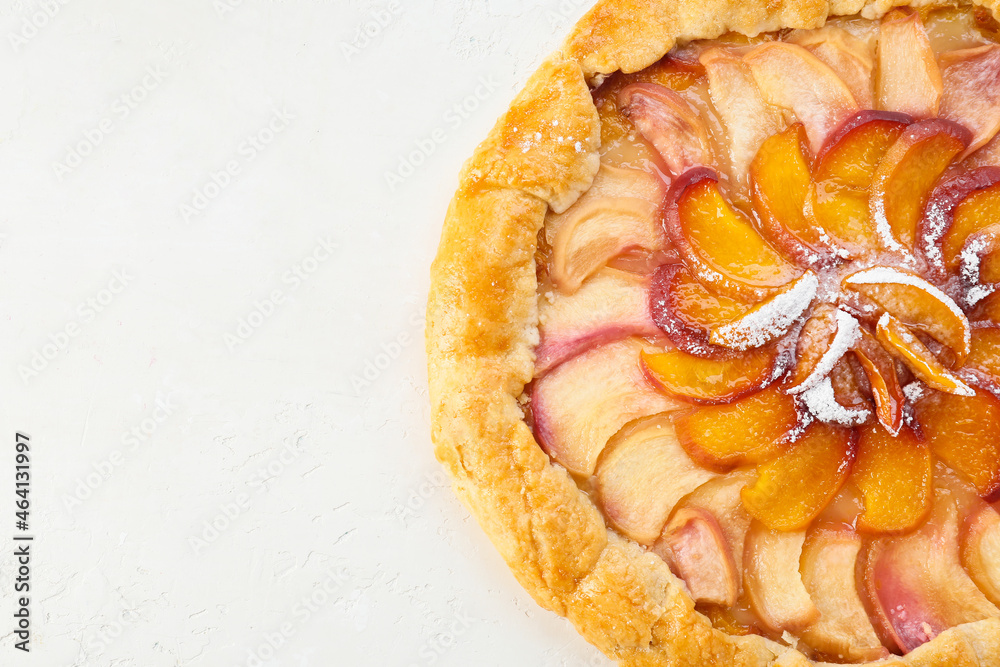 Tasty peach galette on light background, closeup
