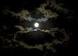 The full fall hunterÕs moon rises behind clouds