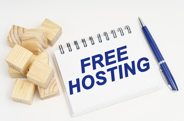Poster - On the table are cubes, a pen and a notebook with the inscription - free hosting