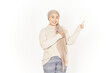 © Sino Images Studio - Presenting and Pointing Aside of Beautiful Asian Woman Wearing Hijab Isolated On White Background