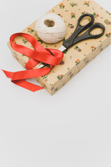 Poster - decorated paperboard box with lid decorative yarn and scissors on a white background