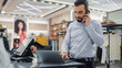 © Gorodenkoff - Modern Clothing Store: Friendly Customer Support Specialist Talks to Client on the Smartphone. Smiling Retail Sales Manager or Young Designer Contacts Client about Online Order in Fashion Shop