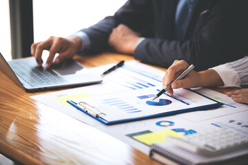 Team work with business analytic price chart on the table at the conference room.