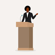 Black Woman Public Speaker Giving Speech At A Podium.