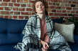 © gpointstudio - Depressed young caucasian woman flooring in silence  next to sofa