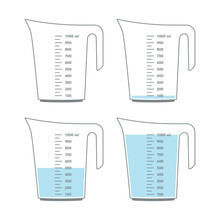 Kitchen measuring cups with various amount of liquid.
