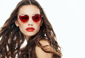 Wall Mural - attractive brunette wearing sunglasses bare shoulders clear skin