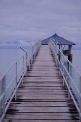  Using a wide aperture, the camera was focused in the middle of the foot bridge that connects the shoreline to the cottage in the middle of the sea.