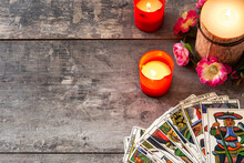 Tarot Cards On Wooden Table With Candles. Copy Space