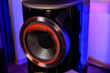 An expensive premium home stereo speaker system. Loudspeaker diffuser. Home audiophile studio. Blue backlighting, evening, intimacy and music enjoyment.