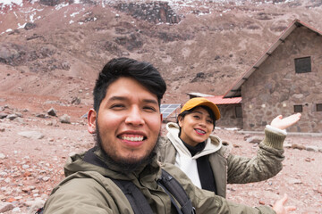 Poster - Closeup of a young couple enjoying their trip to the mountains. Ecuador, the Andes.