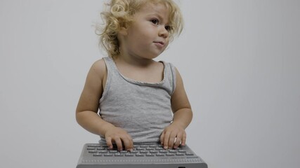 Small girl typing on keyboard