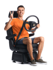 Sticker - Man in car seat and with steering wheel showing victory gesture on white background