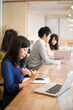 © amanaimages - シェアオフィスで仕事をしている人たち