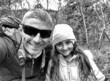 Grayscale selfie of a father and daughter going to hike