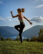 girl practices yoga in a mountain meadow