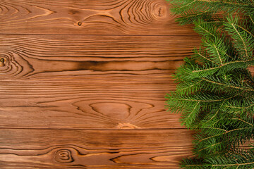 Poster - christmas background. fir branches on natural wooden texture