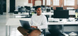 © Jacob Lund - Young programmer smiling in a modern office