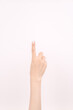 © Jun - hand showing number one In front of the white background,