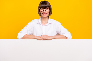 Wall Mural - Photo of excited lady arms white poster empty space wear eyeglasses white shirt isolated yellow color background