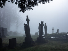 English Country Graveyard In The Fog
