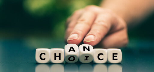 Wall Mural - Hand turns dice and changes the word choice to chance. Symbol that every choice is also a chance.