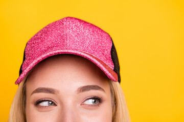 Sticker - Cropped photo portrait woman in cap cunning looking empty space isolated vibrant yellow color background