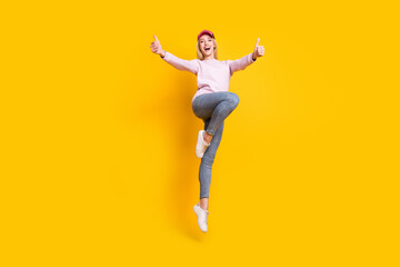 Sticker - Full body photo of young cheerful girl happy positive smile jump show thumb-up like fine ad isolated over yellow color background