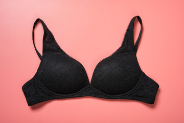 Wall Mural - black bra for women on pink background