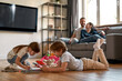 Leinwandbild Motiv Happy family with children relax at home on weekend