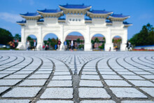 Blurred The Main Gate Of National Taiwan Democracy Square Of Chiang Kai-Shek Memorial Hall On A Sunny Day. The Meaning Of The Chinese Text On The Gate Is “liberty Square” And Focus On The Floor