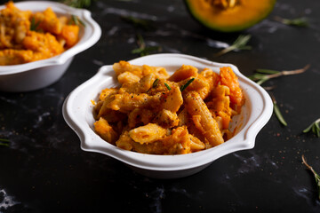 Wall Mural - Pasta with pumpkin and welnuts, a complete vegetarian dish. Ideal for an autumn lunch