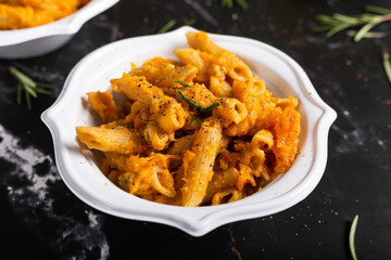 Wall Mural - Pasta with pumpkin and welnuts, a complete vegetarian dish. Ideal for an autumn lunch