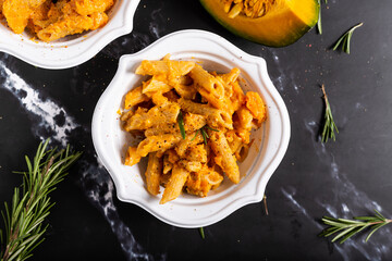 Wall Mural - Pasta with pumpkin and welnuts, a complete vegetarian dish. Ideal for an autumn lunch