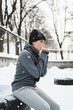 Young athletic woman during her outdoors winter workout