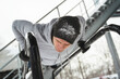Athletic man doing push ups during his calisthenics winter workout