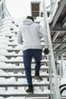 Athletic man running on stairs during his winter workout