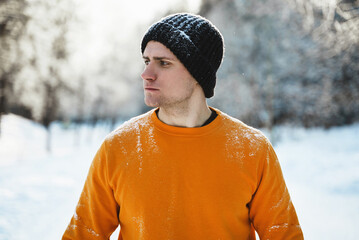 Young jogger man during his workout in winter park