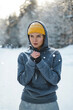 Young athletic woman wearing sportswear ready for a winter workout