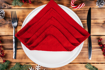 Step-by-step tutorial: Fold linen napkin in shape of Christmas tree. Step 3: Same way set four layers of napkin aside