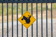 Sign On A Fence About Drinking While Driving A Tractor And Farming Responsibly