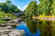 A view along the River Ribble at the top of the falls at Stainforth Force, Yorkshire in summertime