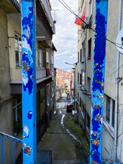 Sticker - City view through stair post newels and a very narrow street