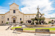 View at the Church of San Domenico with Triton fountain in the streets of Giovinazzo - Italy
