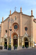 Collegiata di Asti. Collegiate Church of San Secondo in Asti.Facade with circular rose window and entrance portal to the church with brick pointed arch. 